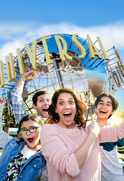 Family taking a selfie in front of the Universal globe at Universal Studios, Los Angeles.