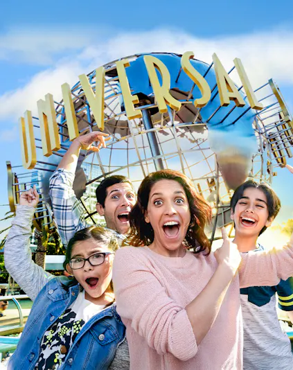 Family taking a selfie in front of the Universal globe at Universal Studios, Los Angeles.
