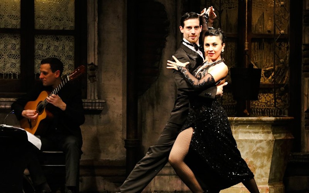 Tango dancers performing at Aljibe Tango Show in Buenos Aires.