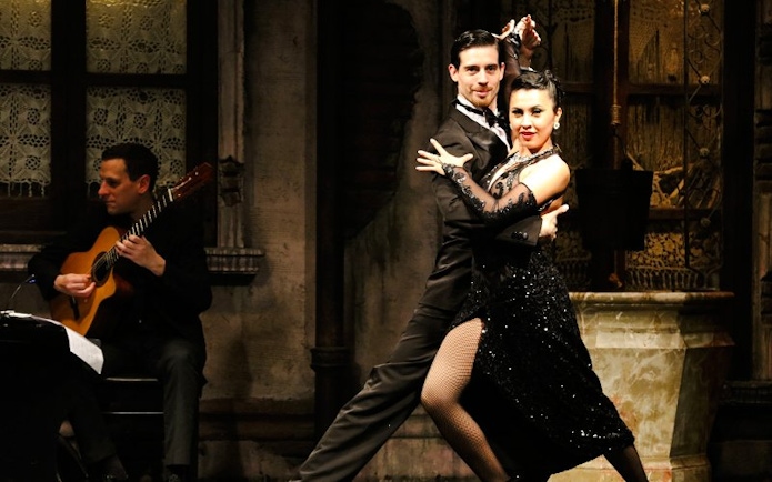 Tango dancers performing at Aljibe Tango Show in Buenos Aires.