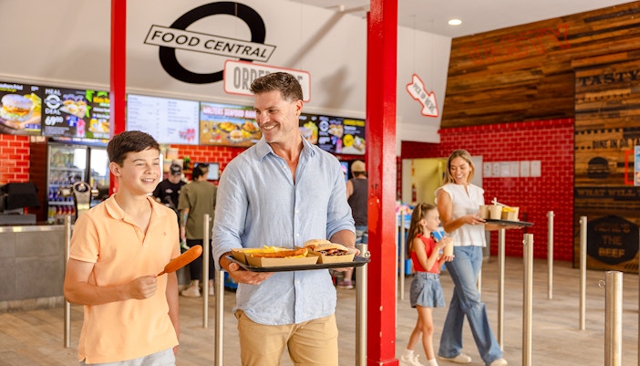 Dining area at Food Central, Dreamworld, Gold Coast with visitors enjoying meals.