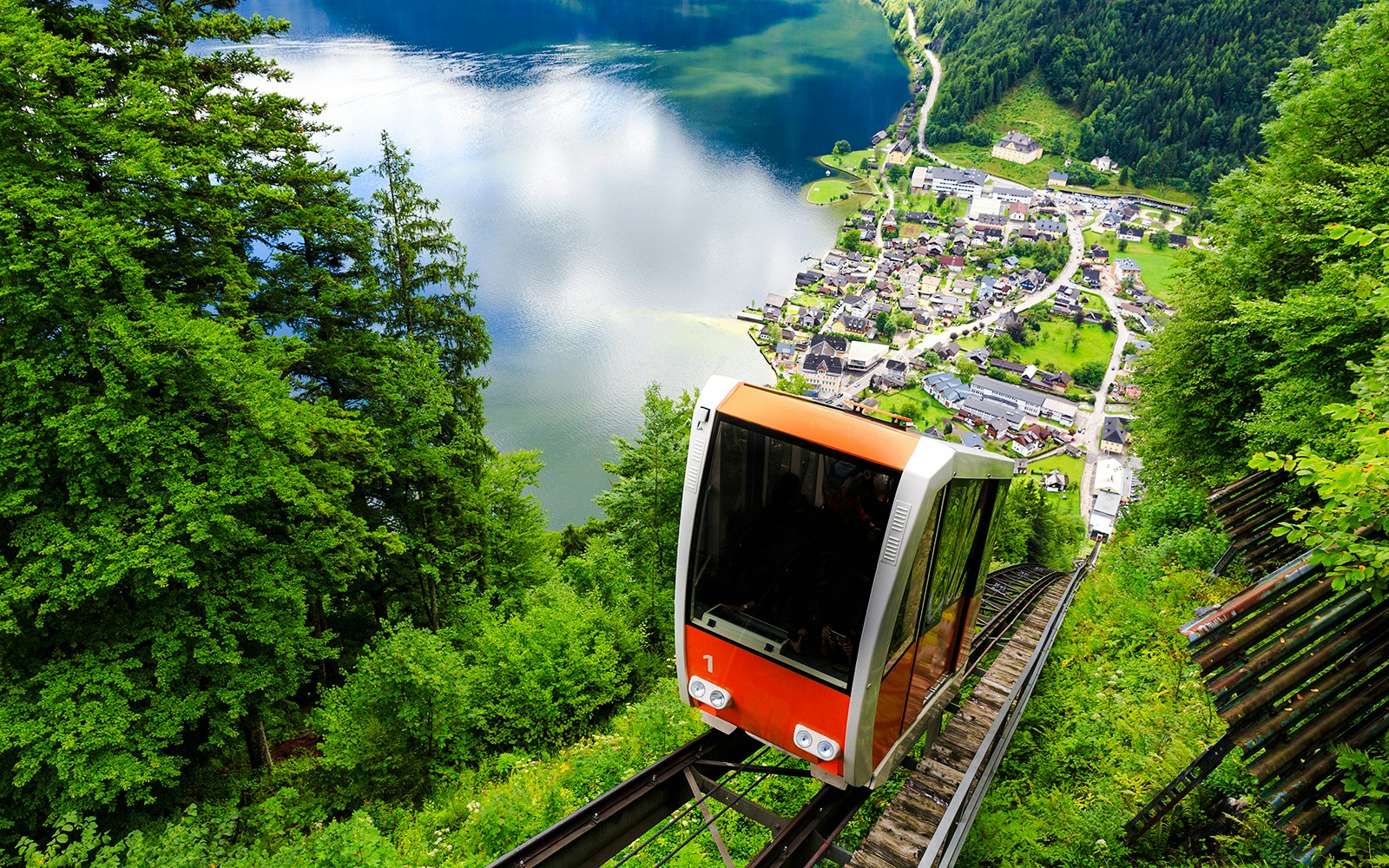 Cable car ascending to Salzwelten with Hallstatt village and lake view, Austria.