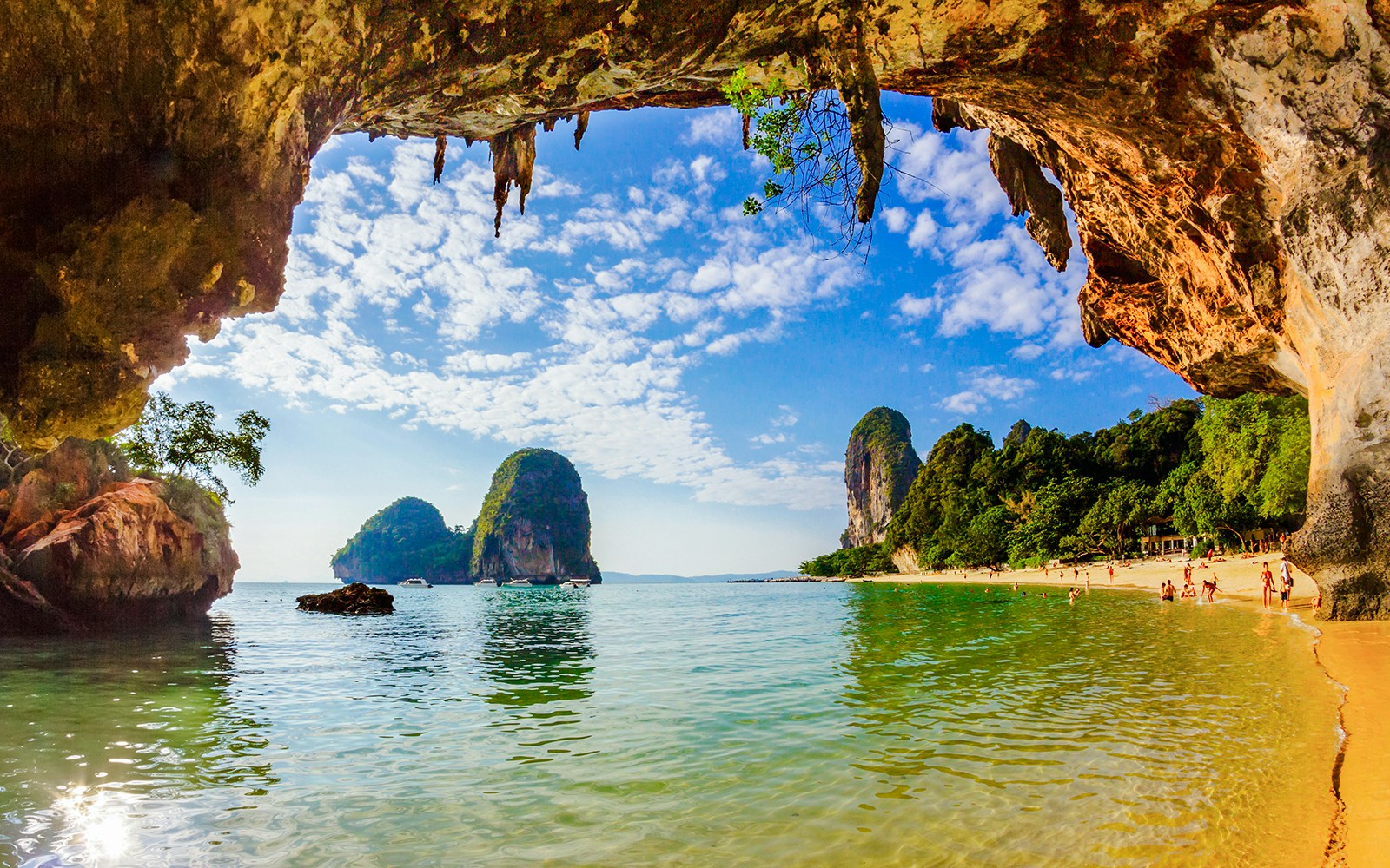 Phra Nang Cave Beach in Krabi with limestone cliffs and clear water.