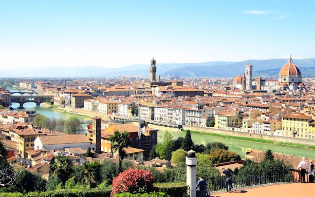 Florence cityscape with Arno River, Ponte Vecchio, and Florence Cathedral.