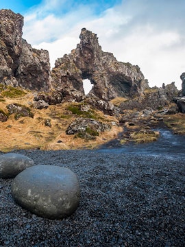 Rocky arch formation on Snaefellsnes Peninsula tour path, Iceland.