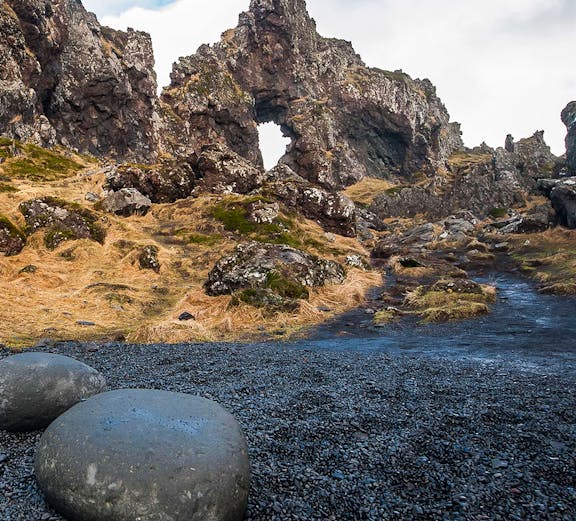 Rocky arch formation on Snaefellsnes Peninsula tour path, Iceland.
