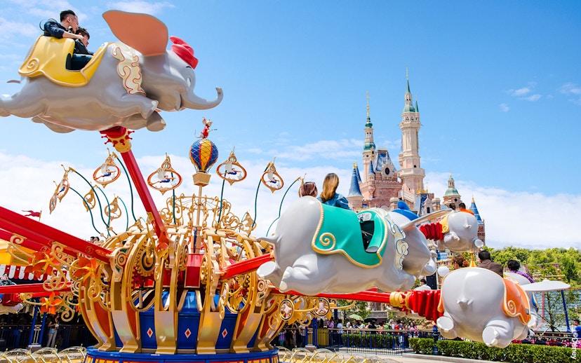 Dumbo ride at Shanghai Disney with Enchanted Storybook Castle in the background.