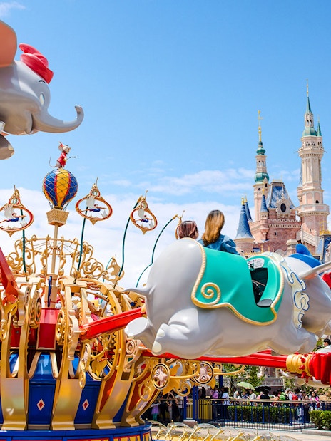 Dumbo ride at Shanghai Disney with Enchanted Storybook Castle in the background.