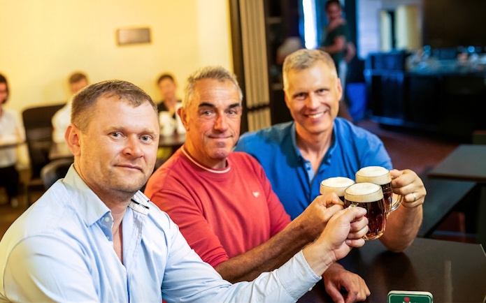 Group enjoying beer at a Prague pub during the Legendary Beer Tour.