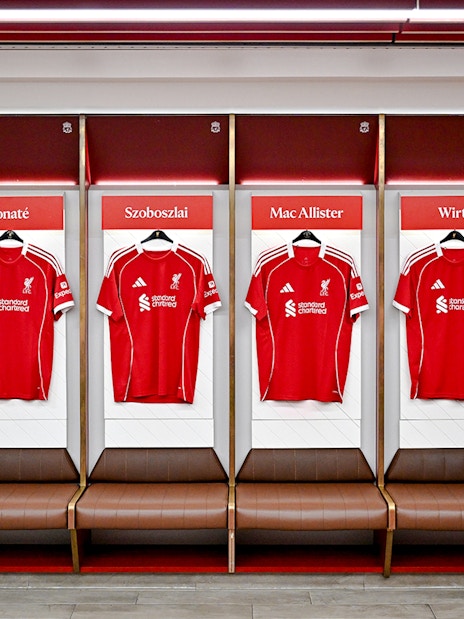 Liverpool FC jerseys in the Anfield Arena dressing room.
