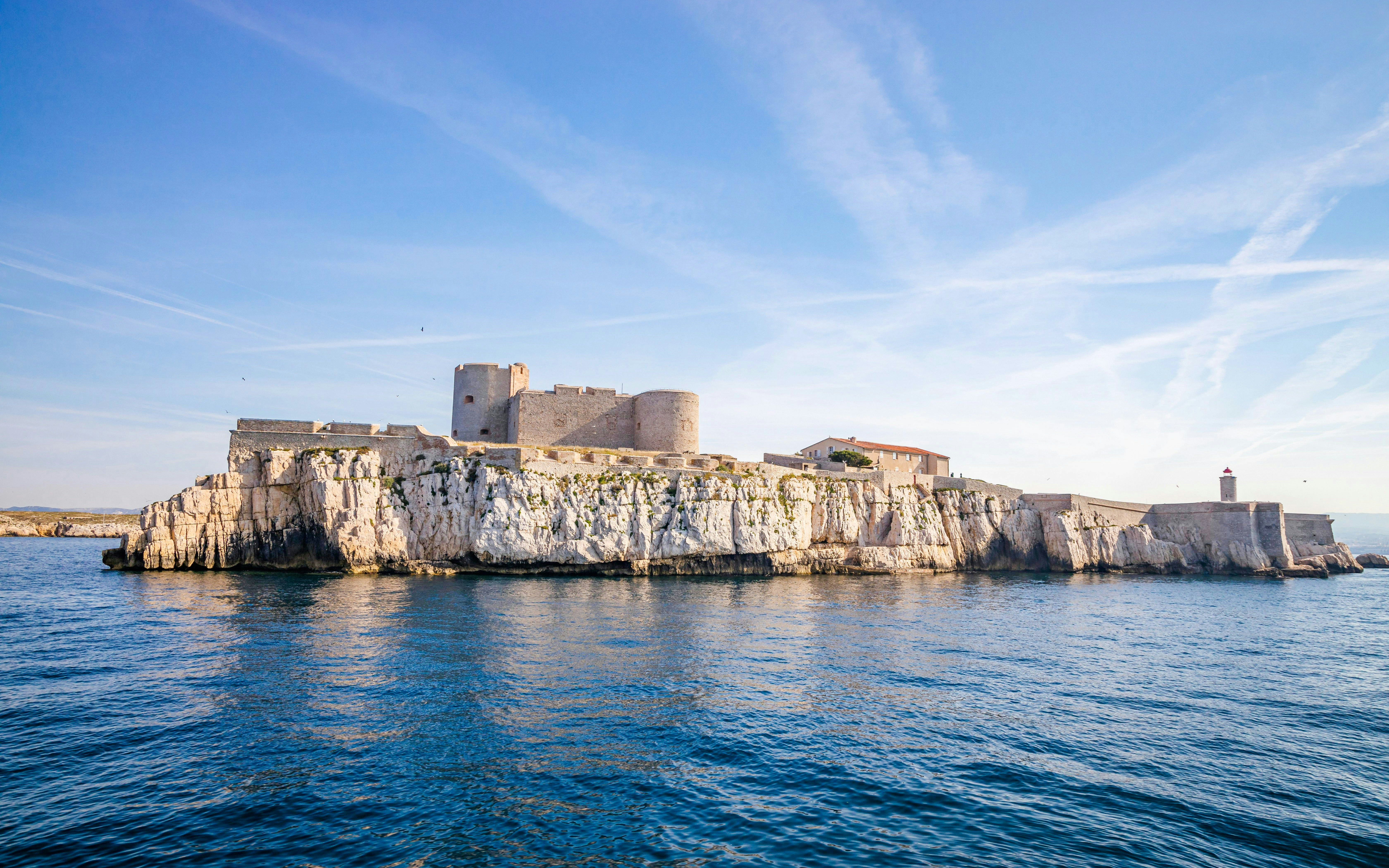 Château d'If on rocky island in Marseille, France, surrounded by blue sea.