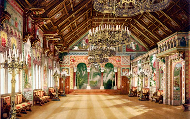 Neuschwanstein Castle interior with ornate chandeliers and detailed wall murals.