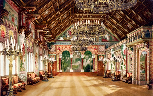 Neuschwanstein Castle interior with ornate chandeliers and detailed wall murals.