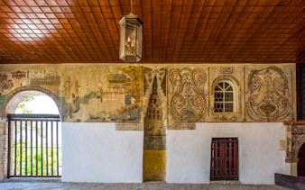 Mihrab in the portico of Bachelor's Mosque, Mangalem quarter, Berat, with intricate wall paintings.