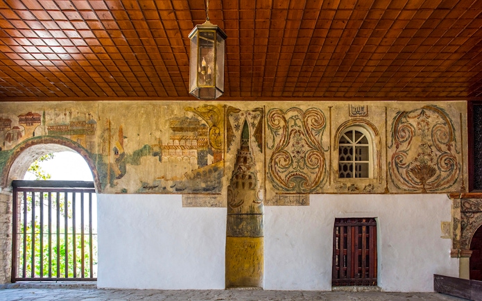Mihrab in the portico of Bachelor's Mosque, Mangalem quarter, Berat, with intricate wall paintings.