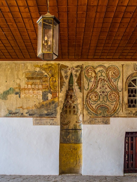 Mihrab in the portico of Bachelor's Mosque, Mangalem quarter, Berat, with intricate wall paintings.