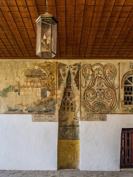 Mihrab in the portico of Bachelor's Mosque, Mangalem quarter, Berat, with intricate wall paintings.