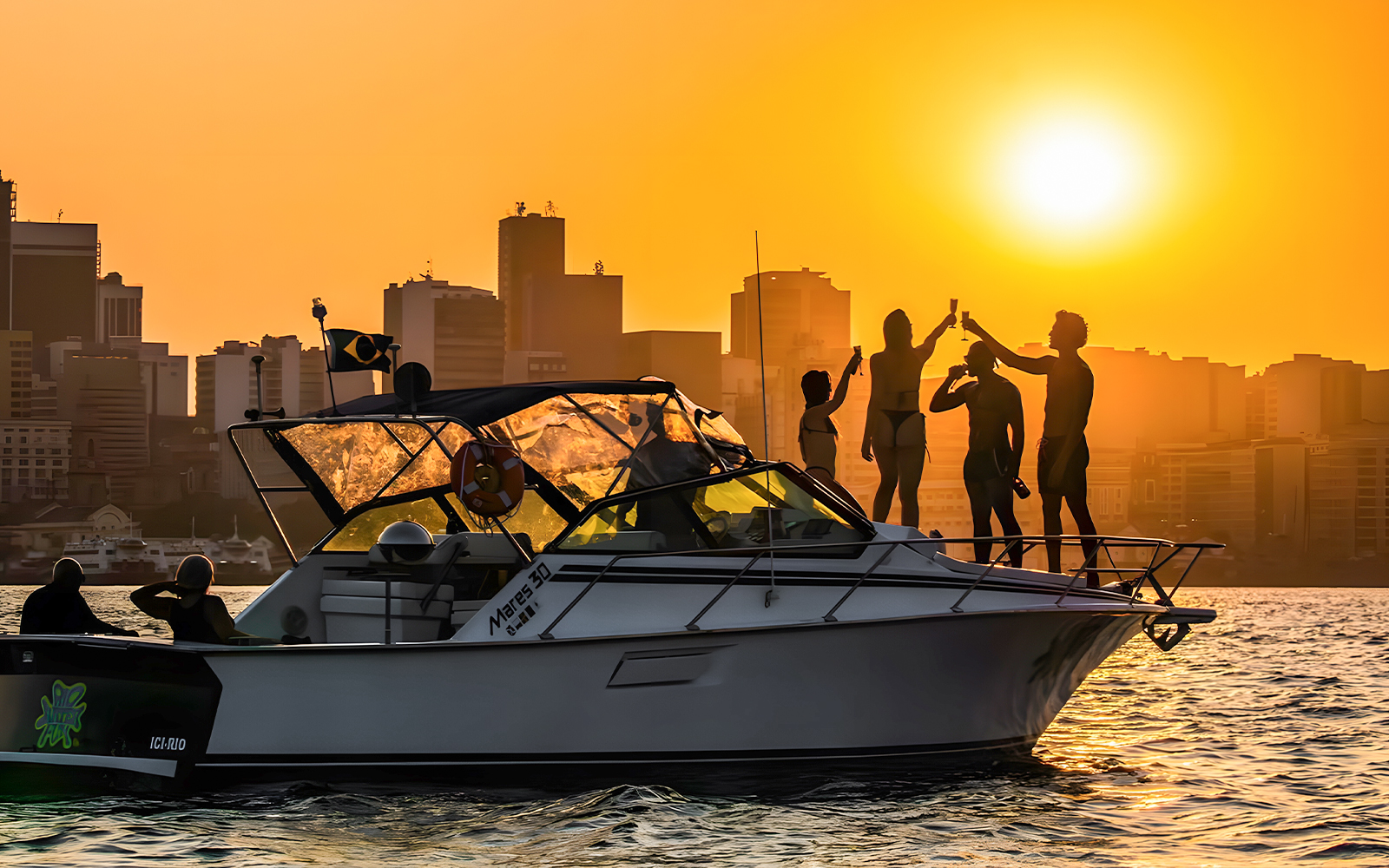 Tourists enjoying a sunset cruise in Rio de Janeiro with city skyline in the background.