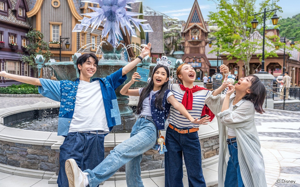 Group enjoying in front of a fountain at Disneyland Hong Kong.