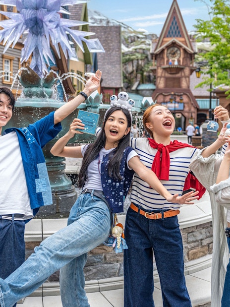 Group enjoying in front of a fountain at Disneyland Hong Kong.