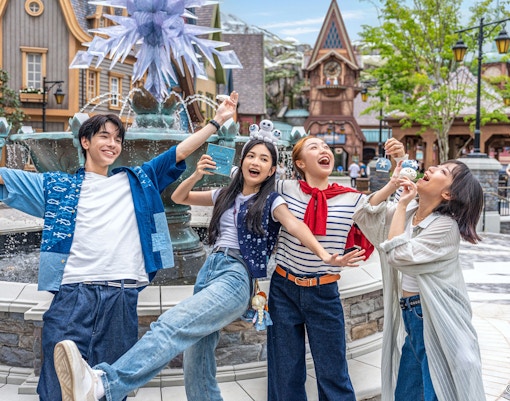 Group enjoying in front of a fountain at Disneyland Hong Kong.
