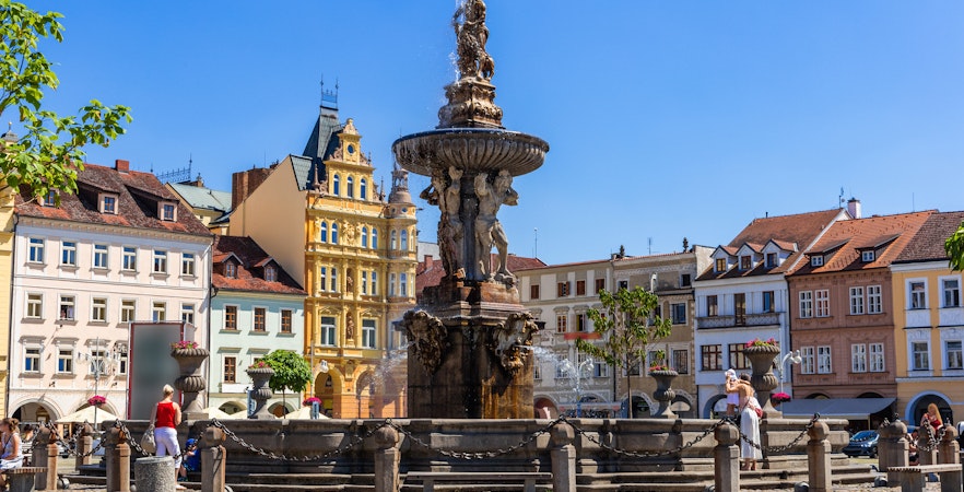 Samson fighting lion fountain and bell tower in main square, Ceske Budejovice.