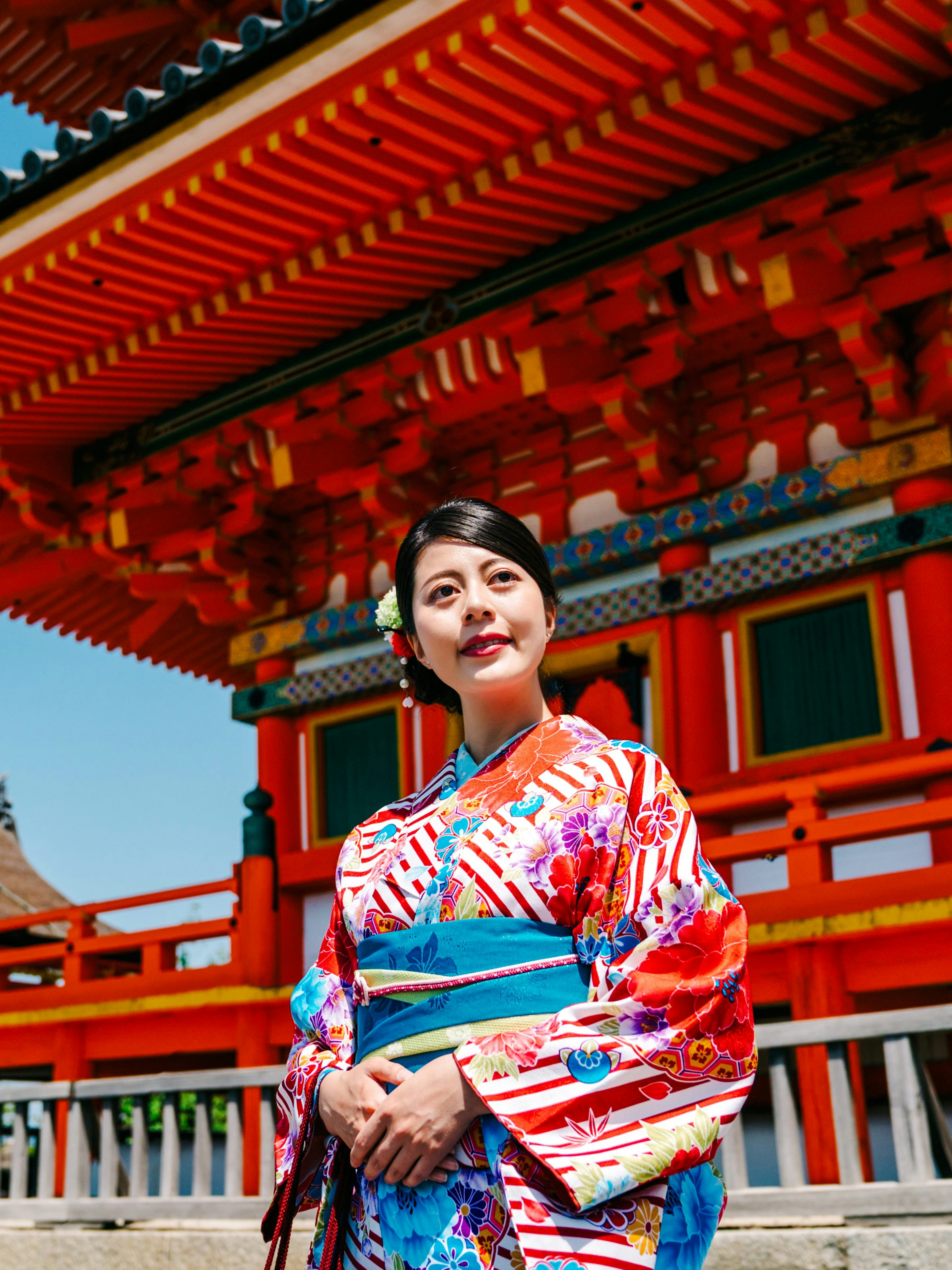 Traveler in kimono at a traditional Japanese temple.