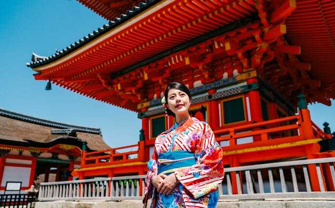 Traveler in kimono at a traditional Japanese temple.