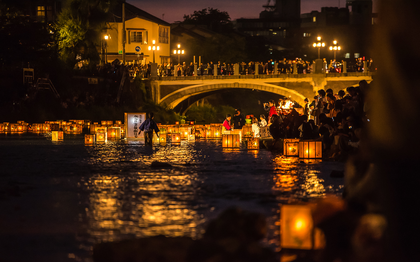 Lanterns floating on Sumida River during festival in Tokyo, Japan.