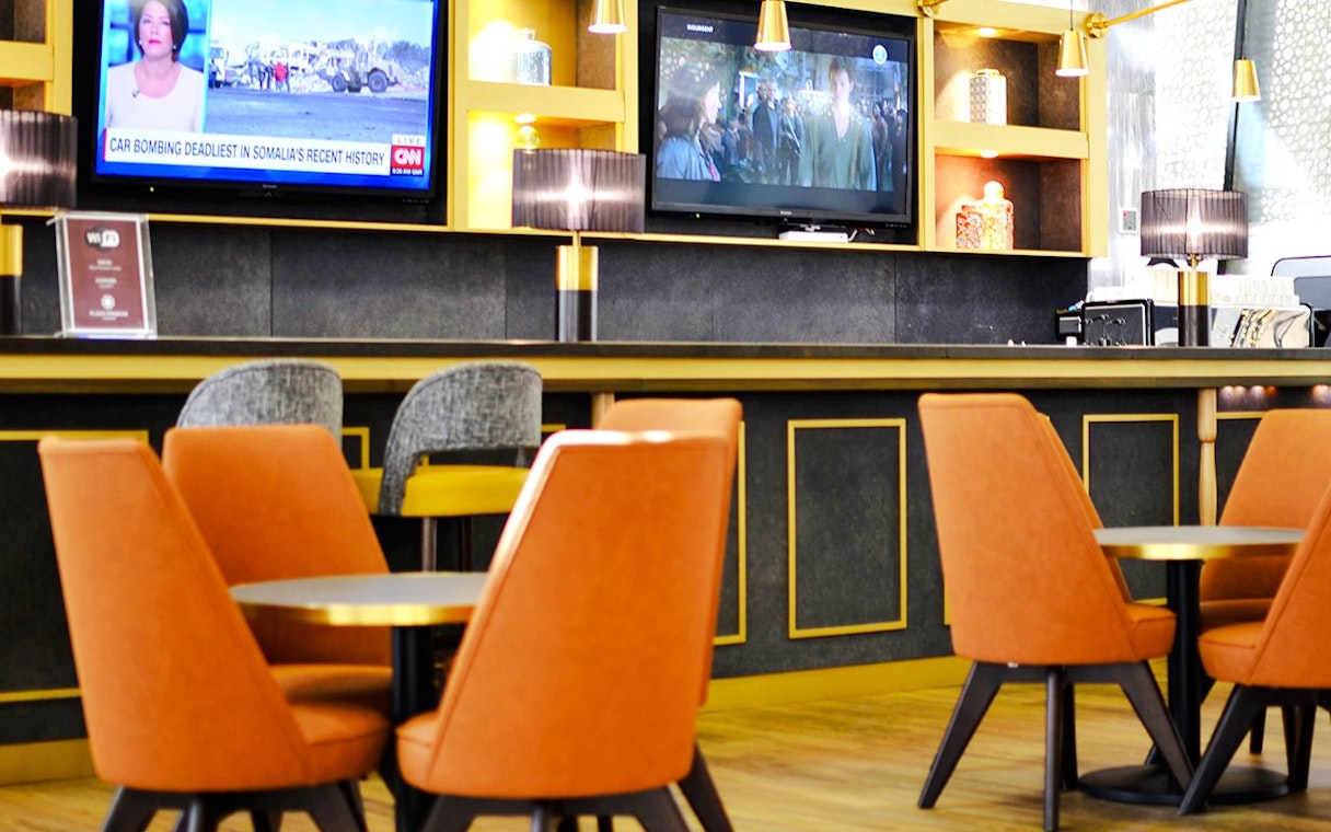 Seating area in Plaza Premium Lounge at King Abdulaziz International Airport.