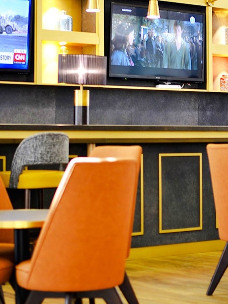 Seating area in Plaza Premium Lounge at King Abdulaziz International Airport.