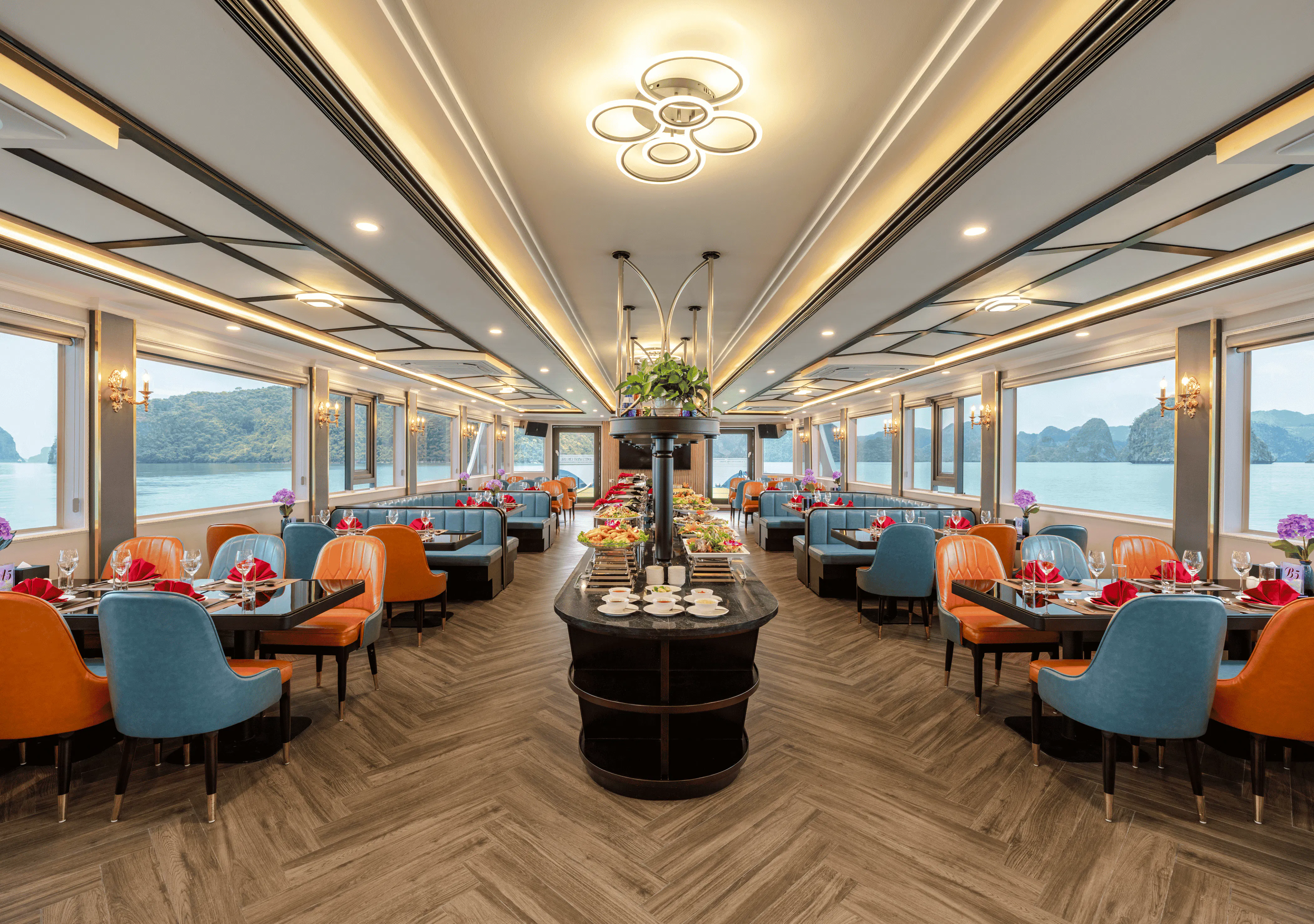 Dining area on Amethyst Cruise with scenic Halong Bay views through large windows.