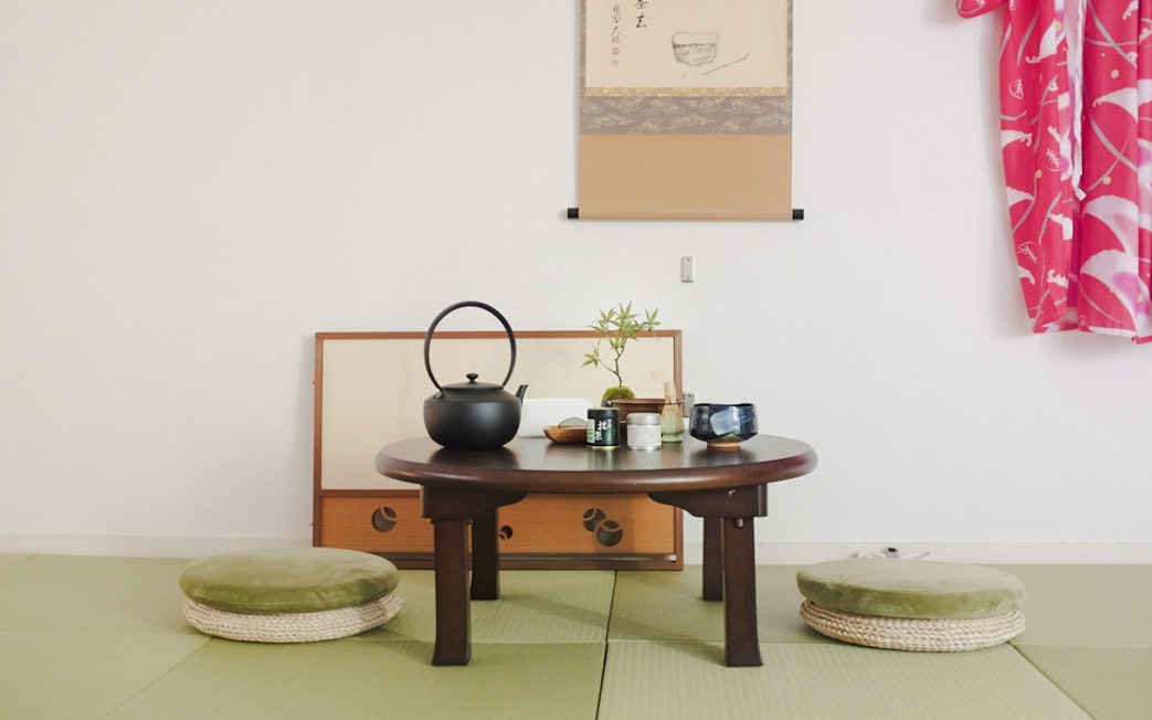 Traditional Japanese tea room setup with tatami mats, tea set, and kimono in Tokyo Matcha & Kimono Experience.