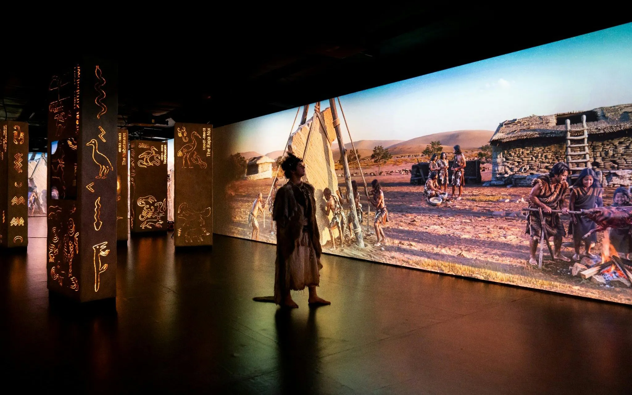 Timewalk Exhibition at Immerse LDN showcasing prehistoric village scene.