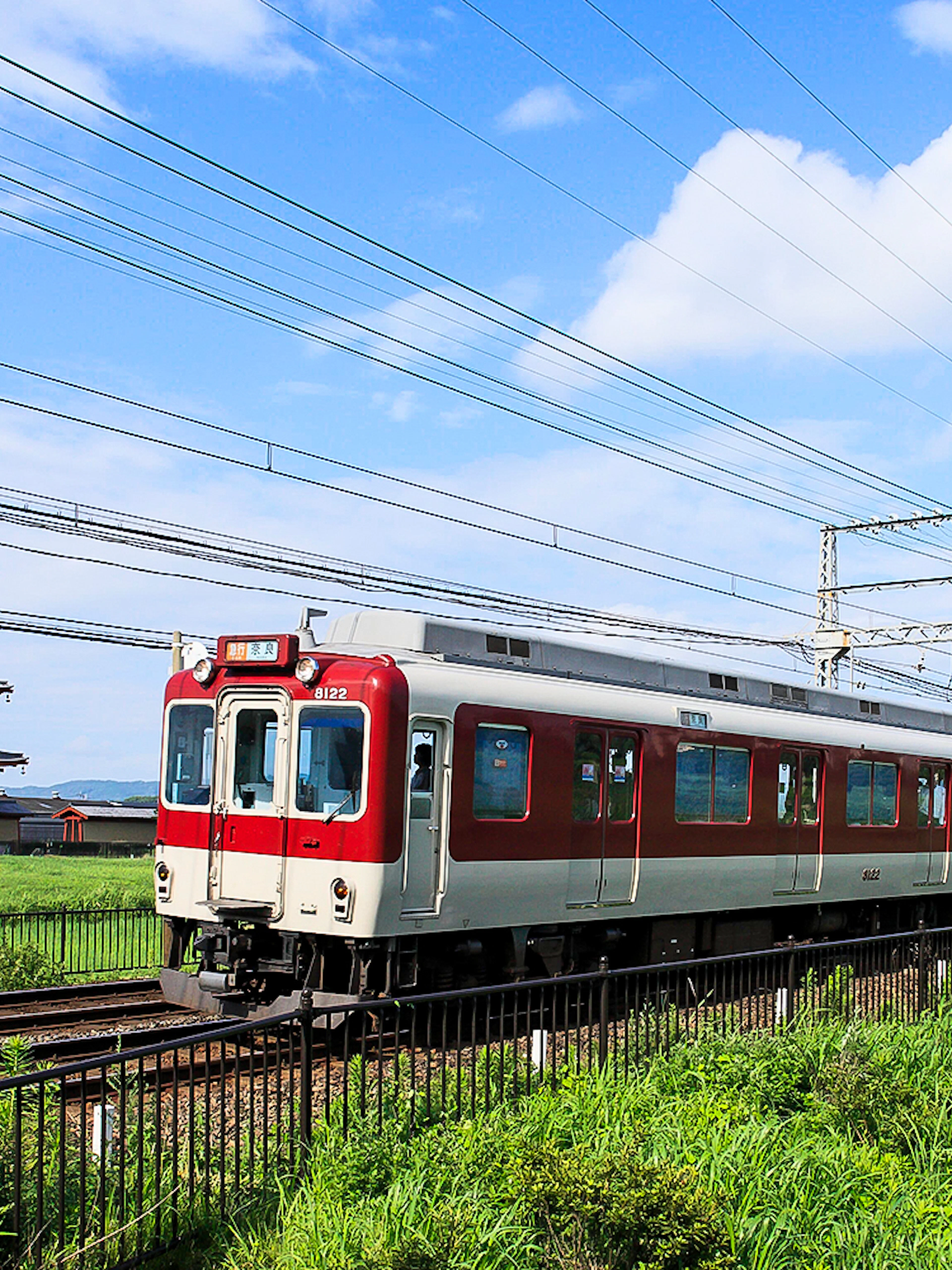 Kintetsu train passing by Heijo Palace in Nara, Japan.
