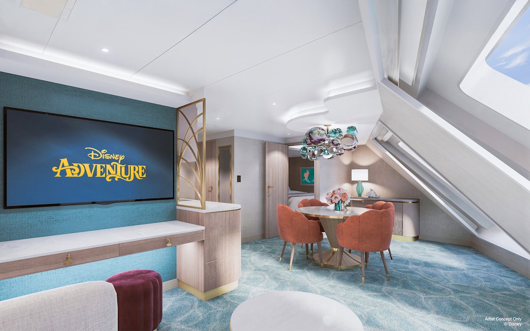 Concierge Oceanview Suite interior on Disney Adventure Cruise with dining area and large TV.