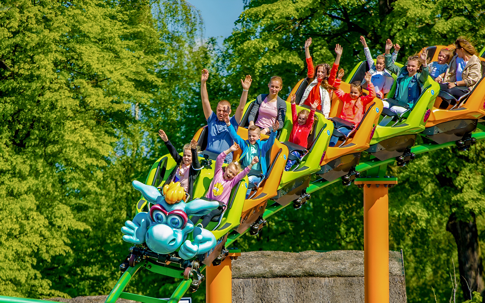 Children enjoying rides at Energylandia Little Kids Zone, Zator, Poland.