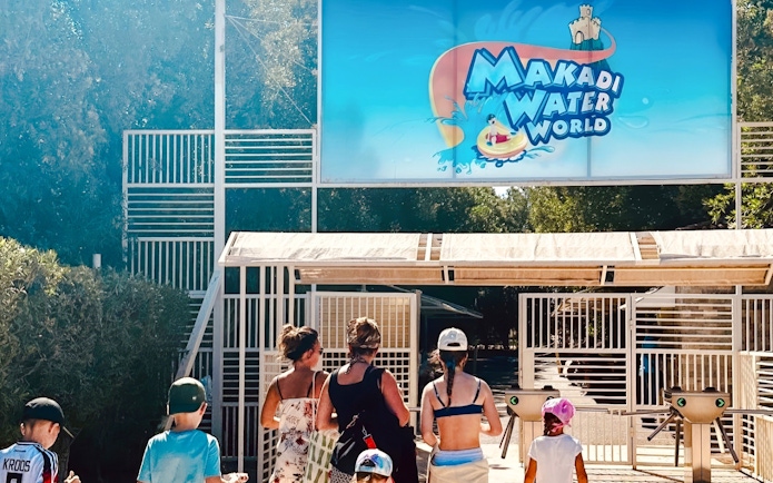 Family entering Makadi Water World entrance in Hurghada.