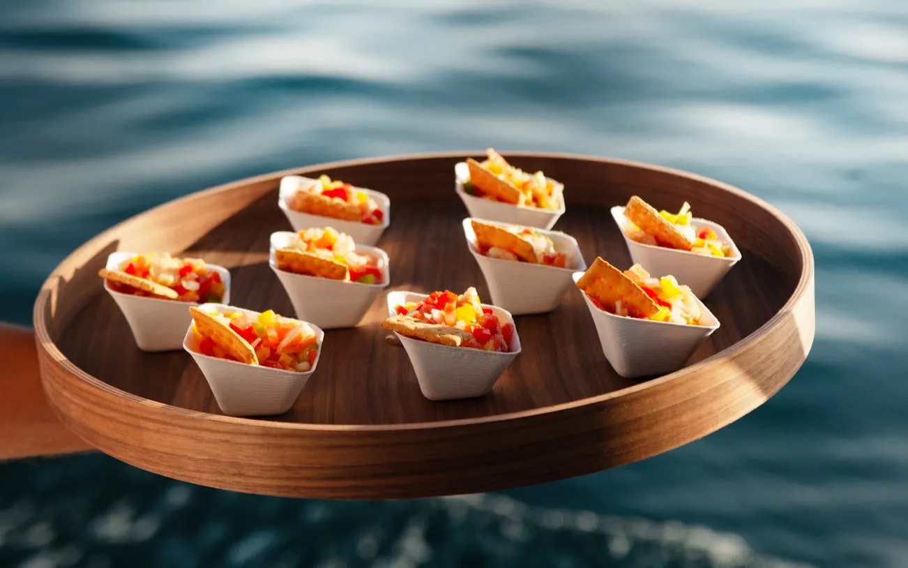 Mediterranean appetizers on a tray during Benalmádena sunset cruise with tasting menu.
