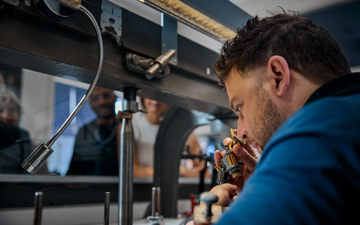 Guest examining diamond at Royal Coster Diamond Experience, Amsterdam.
