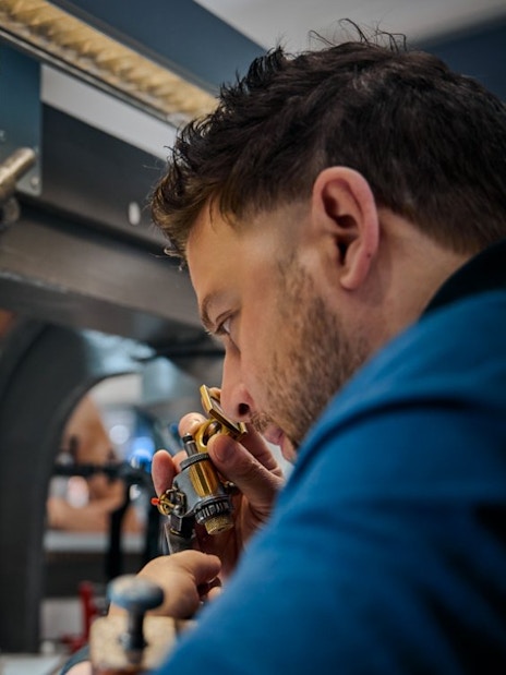 Guest examining diamond at Royal Coster Diamond Experience, Amsterdam.
