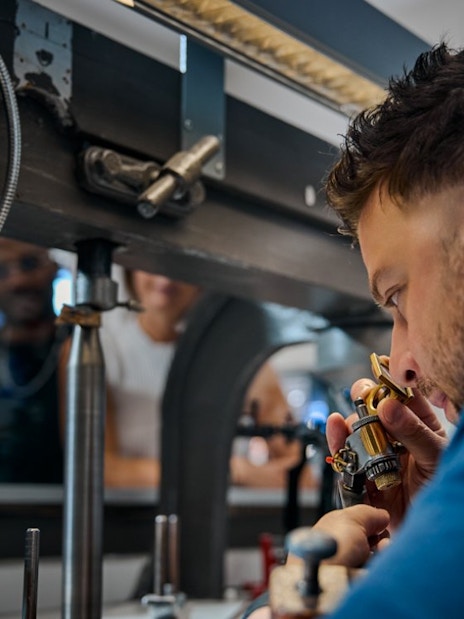 Guest examining diamond at Royal Coster Diamond Experience, Amsterdam.