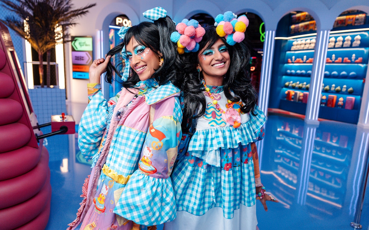 Women in colorful costumes at Enchanted Carnival, Halloween Experience, House of Hype.