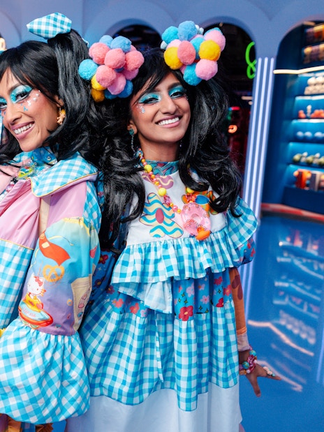 Women in colorful costumes at Enchanted Carnival, Halloween Experience, House of Hype.