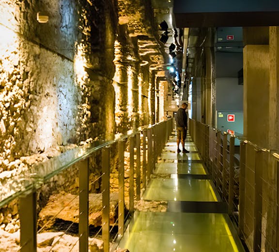 Walkway through ancient ruins at Rynek Underground Museum, Krakow.