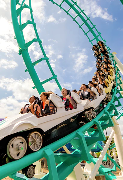 Roller coaster with riders at Dreamworld, Gold Coast, Australia.