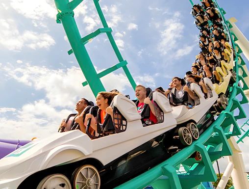Roller coaster with riders at Dreamworld, Gold Coast, Australia.