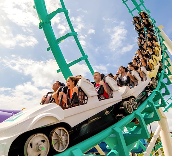 Roller coaster with riders at Dreamworld, Gold Coast, Australia.