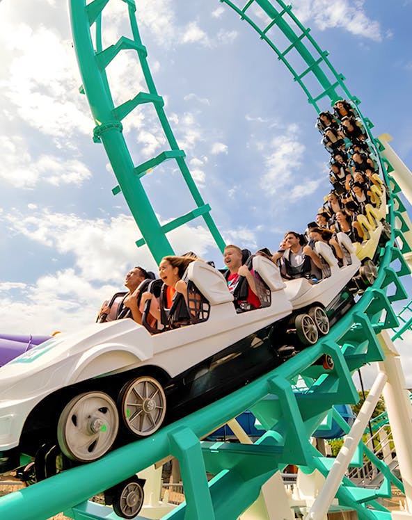 Roller coaster with riders at Dreamworld, Gold Coast, Australia.