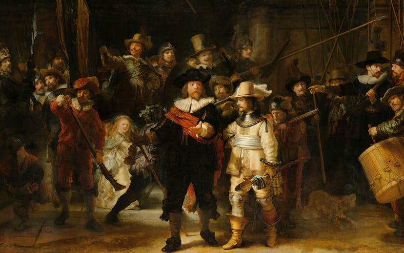 Rijksmuseum visitors viewing Rembrandt's "The Night Watch" in Amsterdam, highlighting Dutch art.
